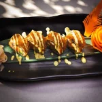 Samisen Maki sushi roll with fresh fish, rice, and seaweed